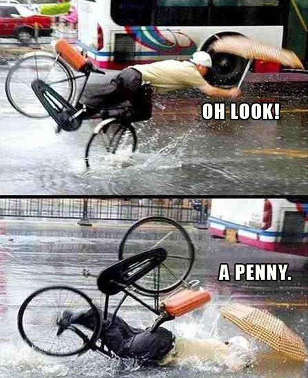 Oh look a penny, man in the rain, crashing on his bike