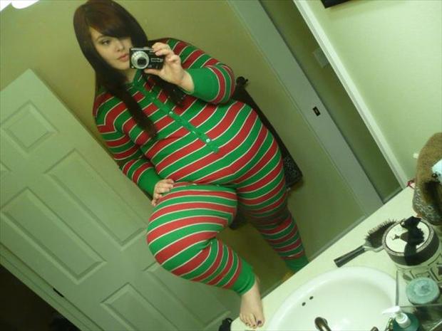 big girl taking profile picture in the bathroom, pajamas on