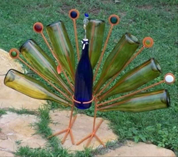 a peacock made from wine bottles