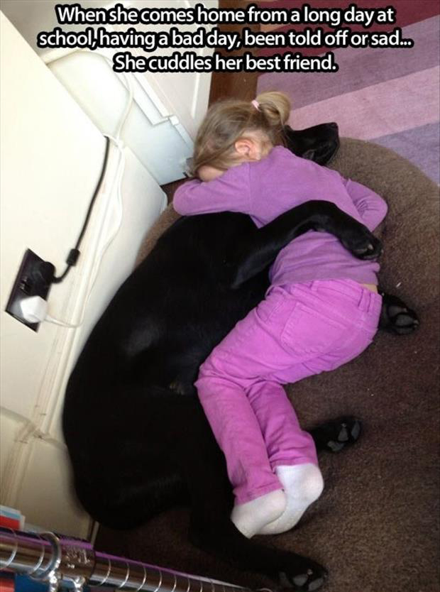 little girl sleeping with her dog