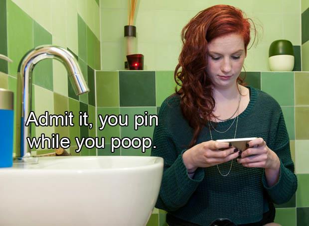 Young woman checking social media on the toilet