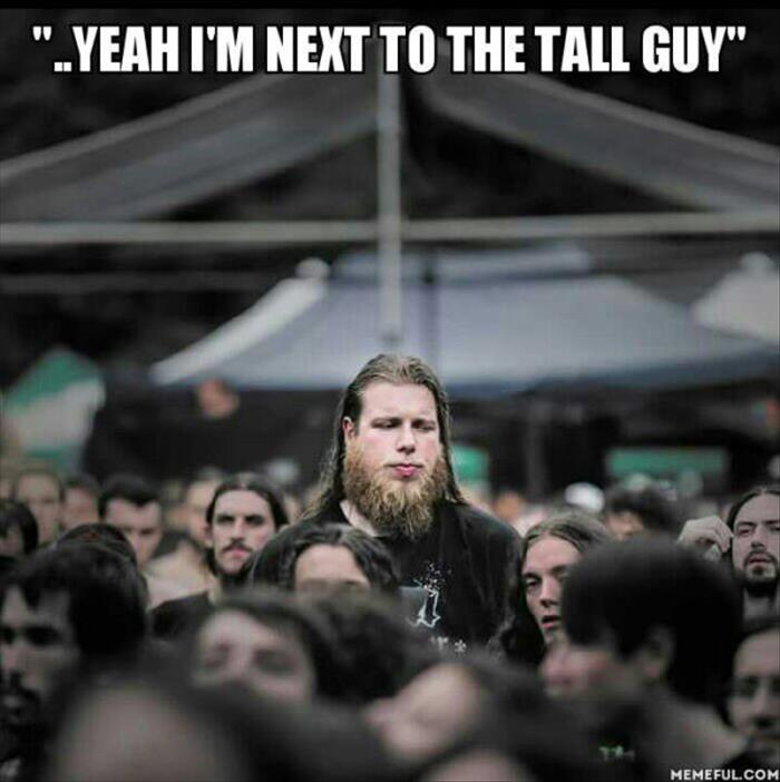 next to the tall guy