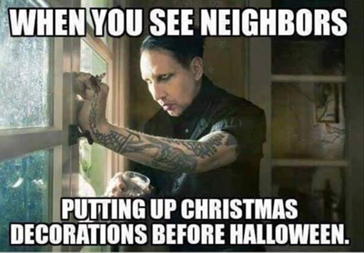 people-putting-up-christmas-decorations-before-halloween